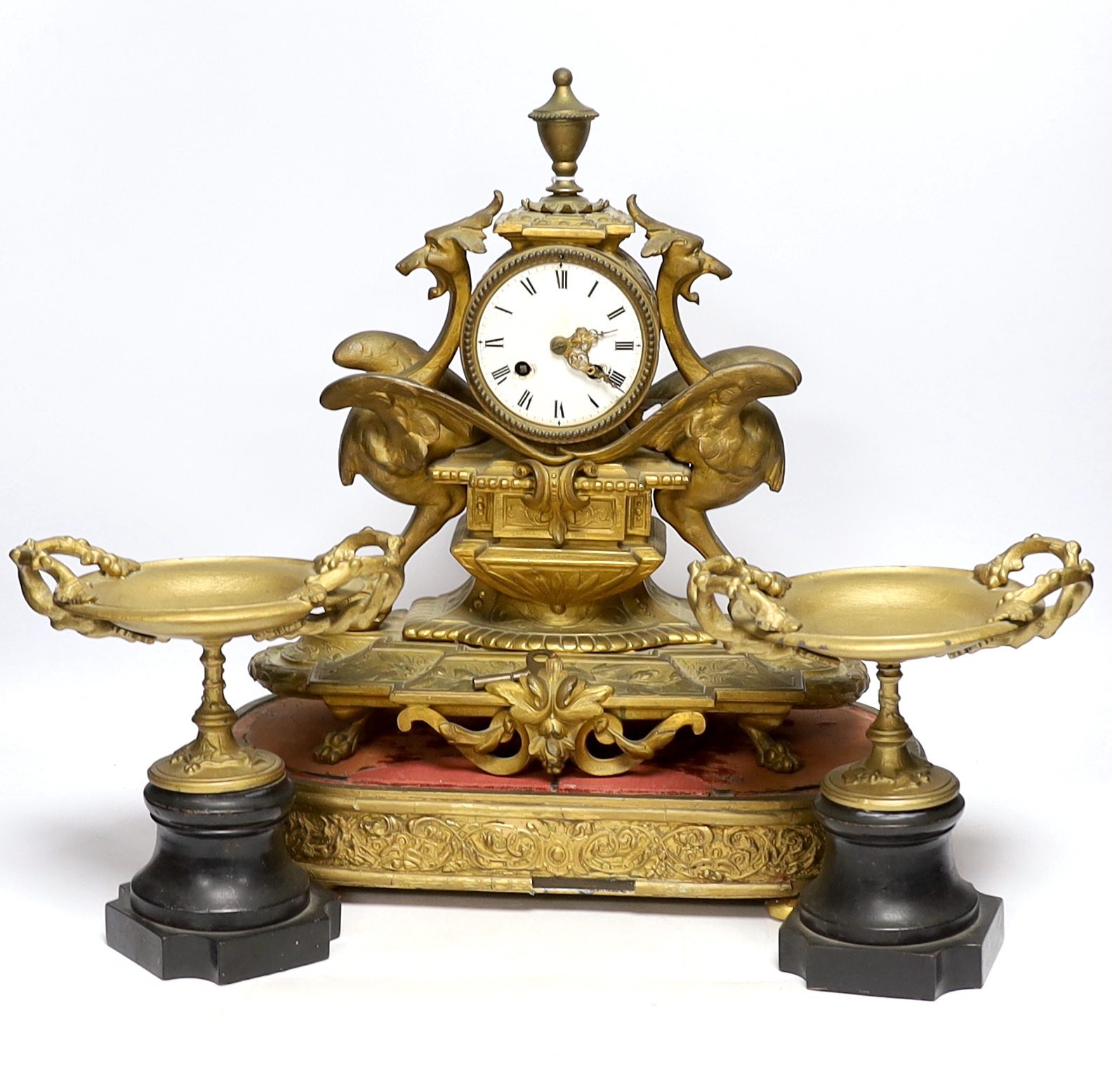 A Victorian gilt painted spelter mantel clock garniture, (dome missing) clock 43cm high